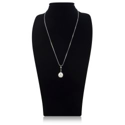 Pearl pendant silver necklace featuring a teardrop shaped pearl linked to a crystal bead and a silver chain. 
