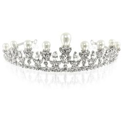 Pearl and crystal metal tiara featuring pearls embeded on top of the spikes and sparkling crytals embeded over an intricately ornated band . 