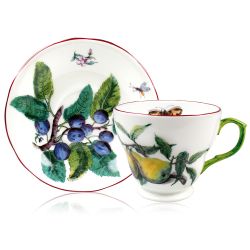 Chelsea Porcelain coffee cup and saucer with a design featuring botanical patterns on both parts and in the inner side of the cup .