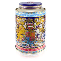 Round tin with the lion and unicorn design at the centre. The lid and edges of the tea caddy are in a gold, purple and light blue design