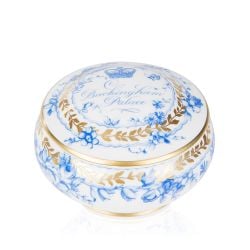 White pillbox with a blue floral garland and bird design and finished with gold detail and gold edge of the pillbox lid