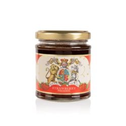glass jar of strawberry jam with a gold lid. The label is red and white with the unicorn and lion crest