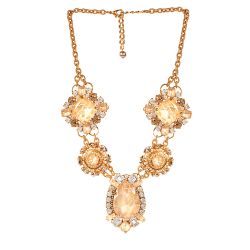 five champagne coloured crystal necklace on a gold chain displayed in an ornate design. All five crystals are arranged in a different design