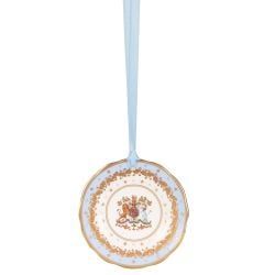 Miniature pale blue plate with gold crown detail. It is  hanging from a pale blue ribbon