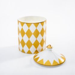 Fine bone English china candle pot printed with white and gold geometric, symmetrical print. The candle has a lid with a gold gilding finish.