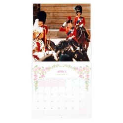 The front cover of a 2022 calendar to celebrate The Queen's 95th birthday. The Queen is on the front cover wearing a pink coat and hat.