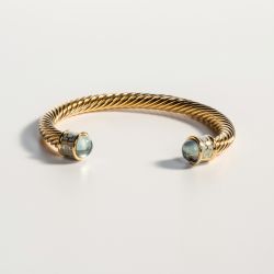 18ct gold plated twisted bracelet with aquamarine coloured glass on the end 