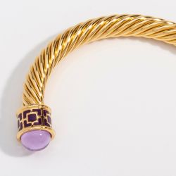 18ct gold plated twisted bracelet with amethyst coloured glass on the end 