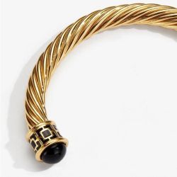 18ct gold plated twisted bracelet with black coloured glass on the end 