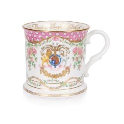 The design of this commemorative tankard is wonderfully inspired by the pink roses in bloom at the time of The Queen’s official birthday, on the East Terrace Garden, Windsor Castle. At the centre of the tankard is a specially painted coat of arms which is
