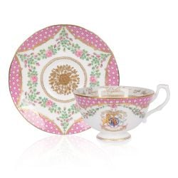 The design of this commemorative teacup and saucer is wonderfully inspired by the pink roses in bloom at the time of The Queen’s official birthday, on the East Terrace Garden, Windsor Castle. At the centre of the teacup is a specially painted coat of arms