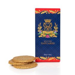 A red and blue box of Scottish oatcakes. The box is blue with red detail at the top and the bottom and a gold leaf design. At the centre is Prince Philip's cypher in gold. Next to the box are three Scottish oatcakes. 