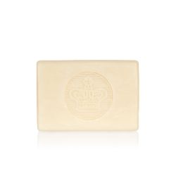bar of soap wrapped in yellow paper printed with oranges and pears. There is also a gold seal with a crown and a white box saying 'Buckingham Palace Pear and Orange Blossom Premium English Soap Handmade in London'