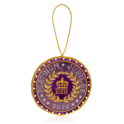 Purple roundel decoration featuring gold threads embroidering EIIR and the words Platinum Jubilee 2022