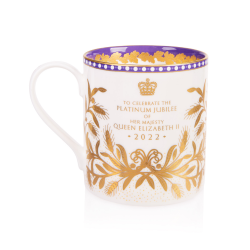White coffee mug featuring a coat of arms and is surrounded by a gold wreath and a gold foliage design