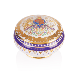 Domed pillbox featuring the coat of arms on the lid and a surround of a gold foliage design and purple border