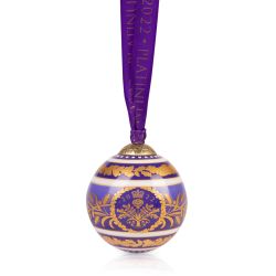 Purple bauble featuring the Platinum Jubilee golden foliage design and the year 2022. It is hung with the purple ribbon
