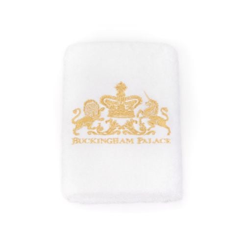 Face cloth with Lion and Unicorn crest in gold thread.