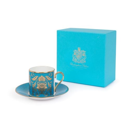 Turquoise cup and saucer with Acanthus gold pattern and finishing on handles and rim.