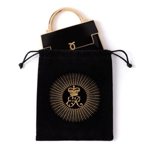 Black and gold handbag shaped compact mirror.