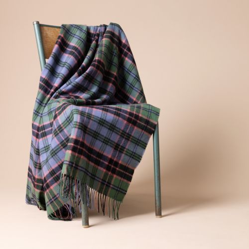 Kinloch Anderson labelled throw in Old Stewart Tartan in green, blue, pink and purple throw.