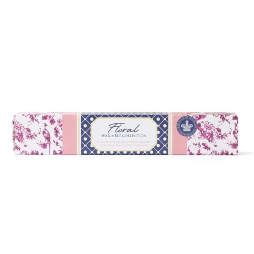 Long rectangular box of floral wax melts with pink and navy patterned packaging, featuring a central label that reads “Floral Wax Melt Collection” and lists scents including Serenity Spa, Secret Garden, Lavender, Cinder Rose, Heather Mist, and The Botanis