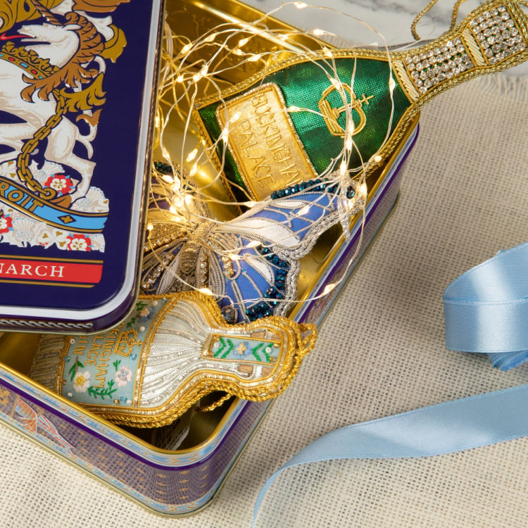 Christmas decorations in a biscuit tin